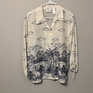 Liz Claiborne button-front blouse features a tropical print, ties at the cuffs.